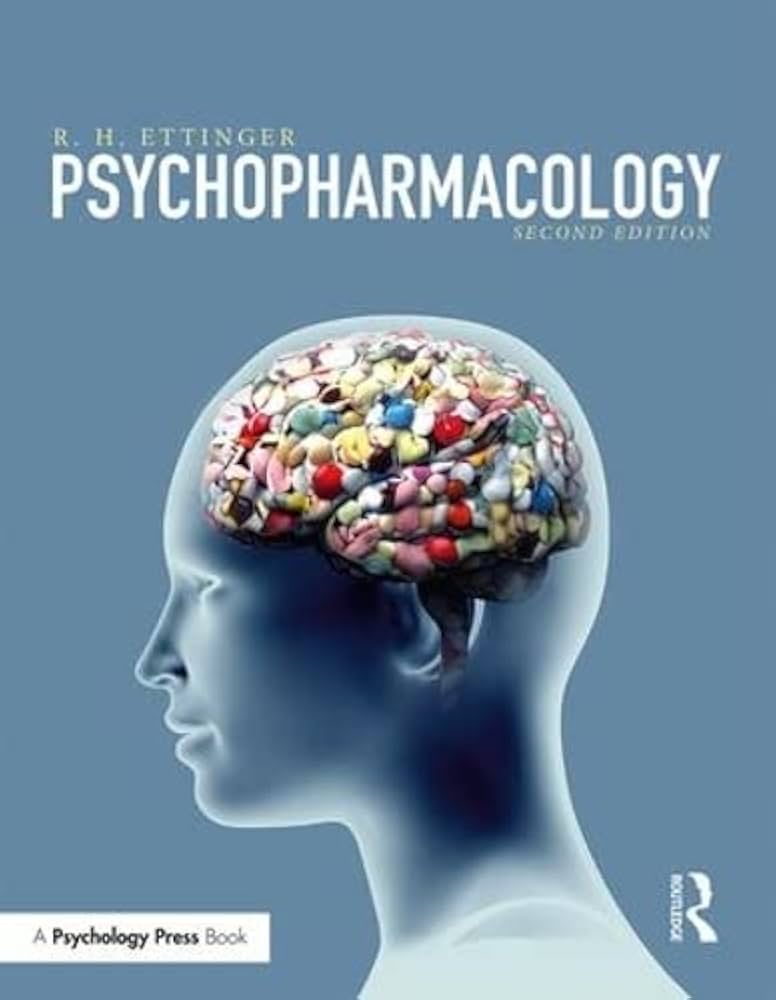 Cover of "Psychopharmacology, Second Edition" by R. H. Ettinger, featuring a human profile with a brain filled with various pills against a blue background.