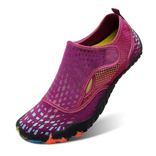 A magenta slip-on water shoe with a black, textured sole and multi-colored accents on the toe area, shown on a white background. A magenta slip-on water shoe with a black, textured sole and multi-colored accents on the toe area, shown on a white background.